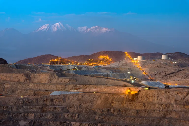 Image of an open-pit copper mine at dusk