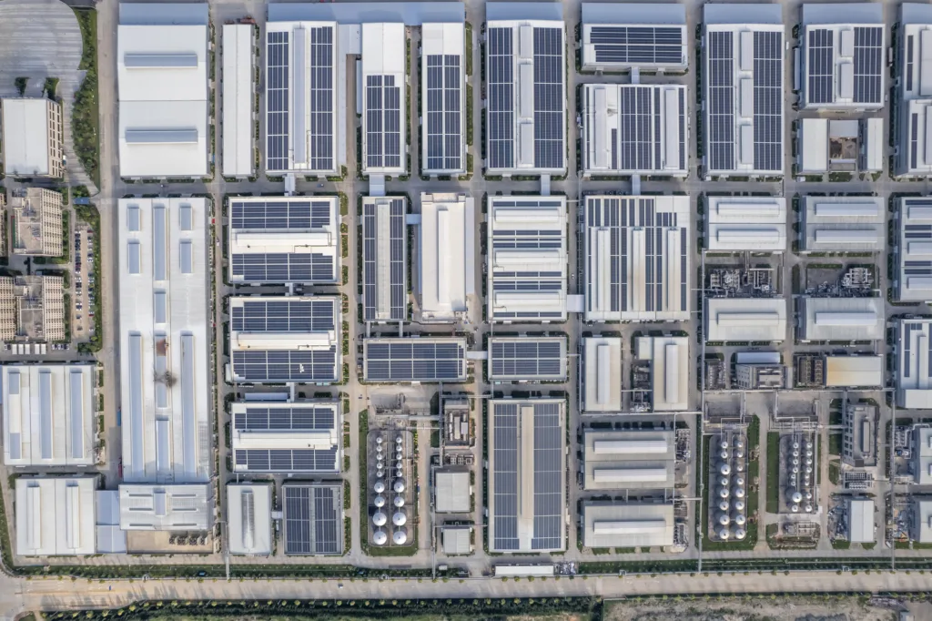 Aerial image of factory block with solar panels on the roofs